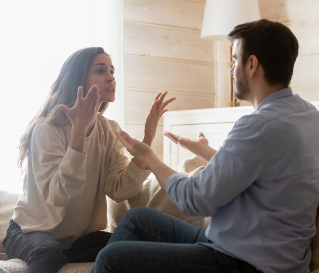 Angry,Young,Couple,Sit,On,Couch,In,Living,Room,Having